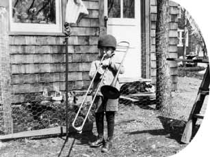 Photograph: Nelson as a boy playing trombone.