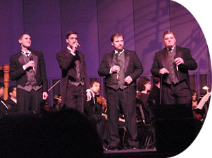 nUAnce vocal group led by conductor Jim Taylor (2nd from right).